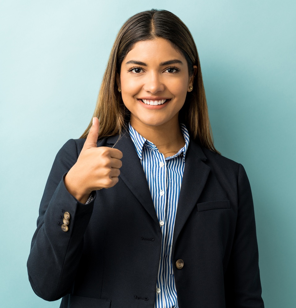Portrait Of Businesswoman Showing Hand Sign In Studio